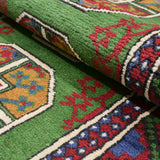 Afghan carpet, approximately 85cm x 195cm