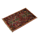 Rich red Afghan Ghazni wool rug with colorful pattern