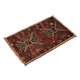 Rich red Afghan Ghazni wool rug with colorful pattern
