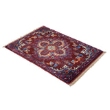 Afghan handmade rug with diamond-shaped medallion
