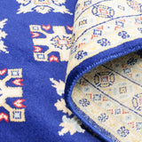 ネイビー地に二種類のひし形模様が規則的に並んだラホール産手織りパキスタン絨毯