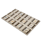 12の枠に動物や木のモチーフを織り込んだギャッベ