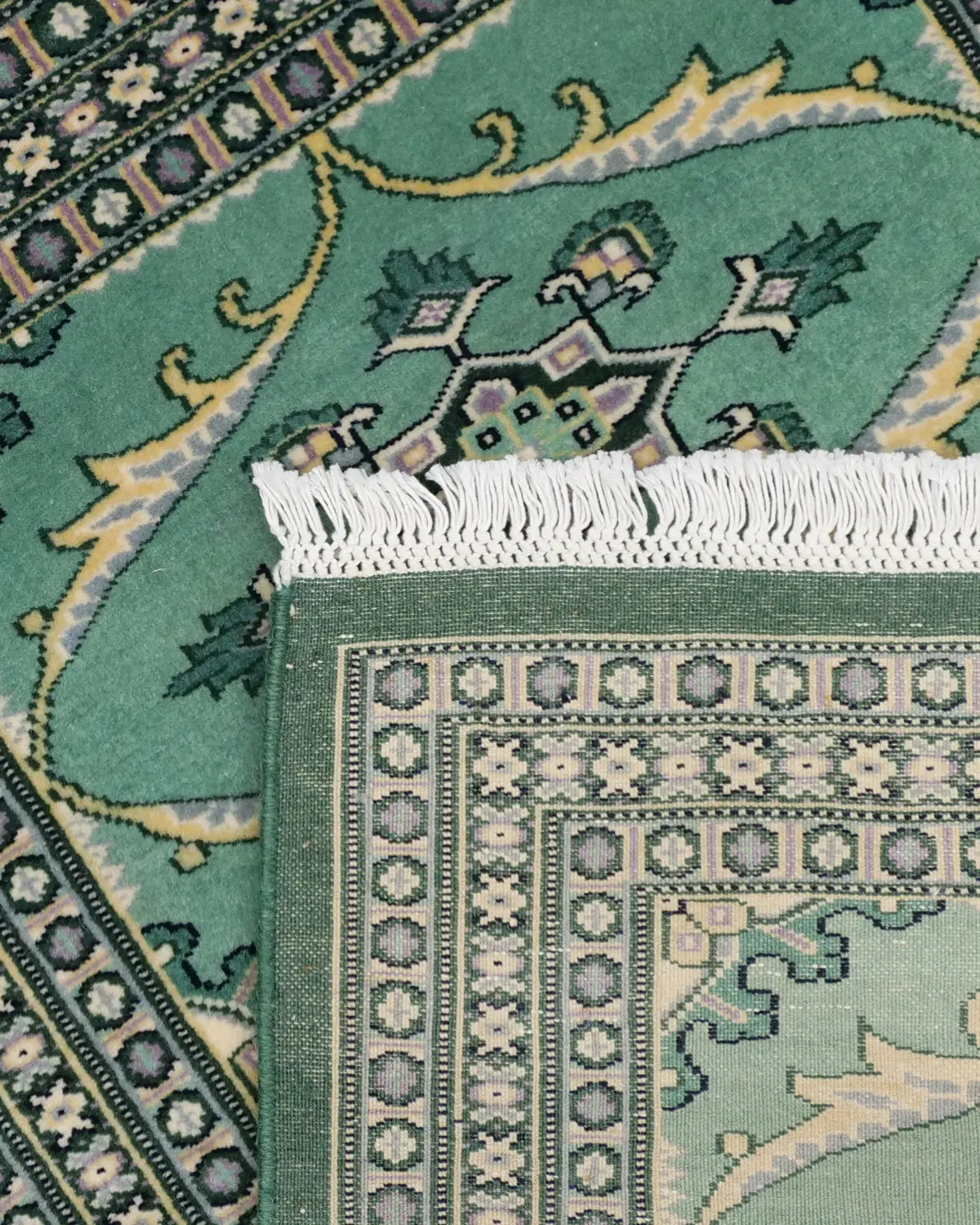 インテリアを彩るパキスタン絨毯 ラホール産 グリーンの手織りラグ